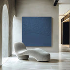 Simple abstract painting in a subtle blue tone, featuring raw imperfections and natural materials for a timeless look.