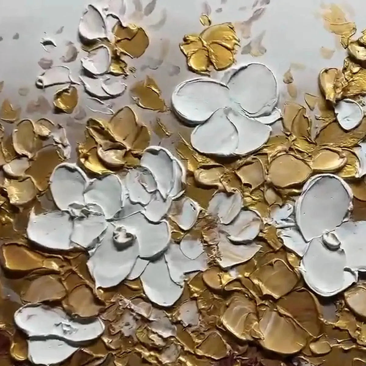 Close-up of the textured golden and white floral details.