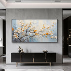 Minimalist living room with blue 3D floral wall art above a black console cabinet.