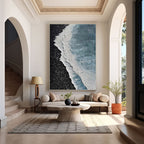Large 3D ocean canvas art in modern entryway.