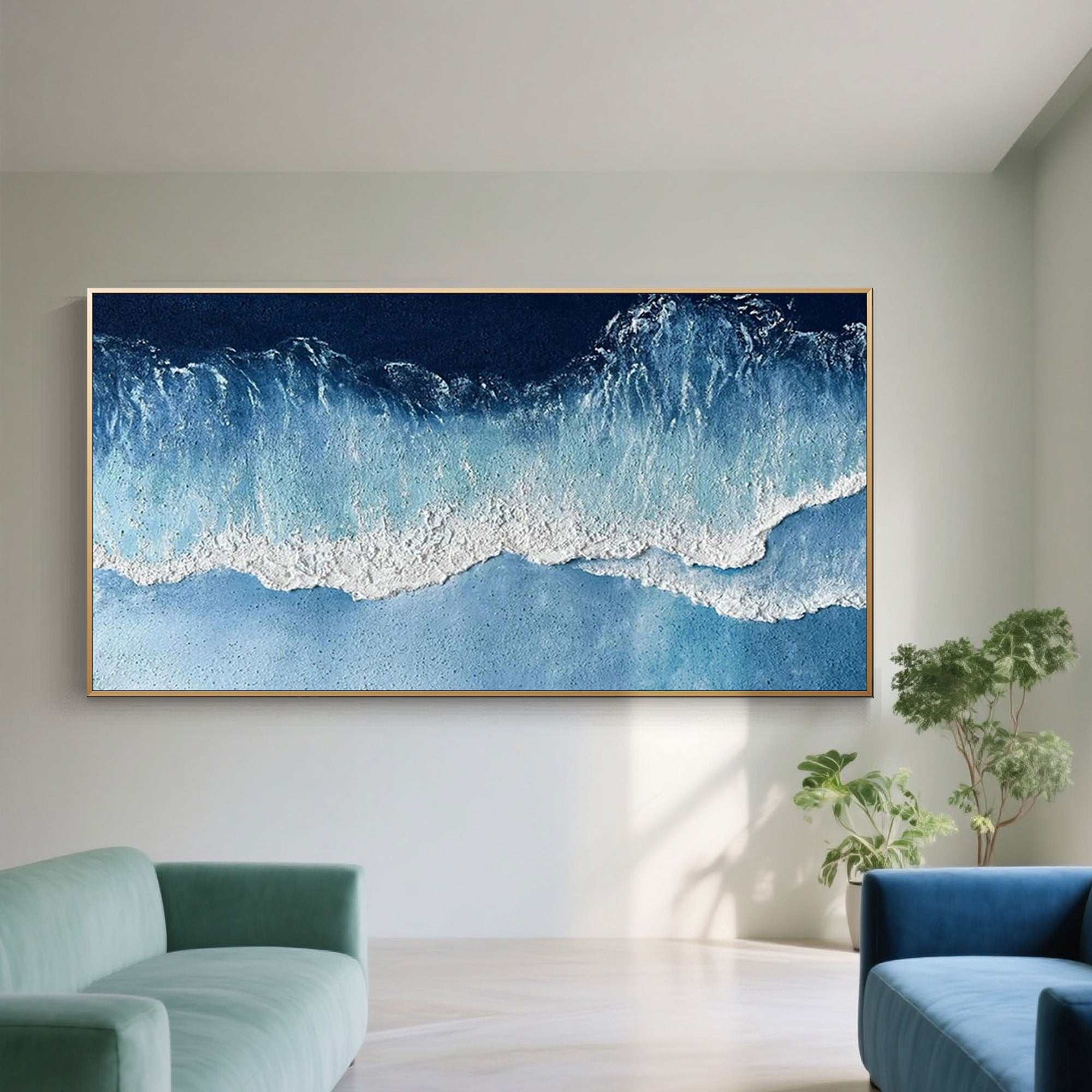 Large ocean wave canvas art with gold frame in a living space.