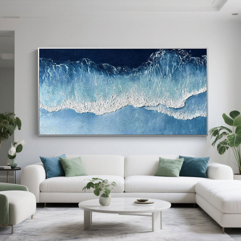 Ocean wave painting in a modern living room setting.