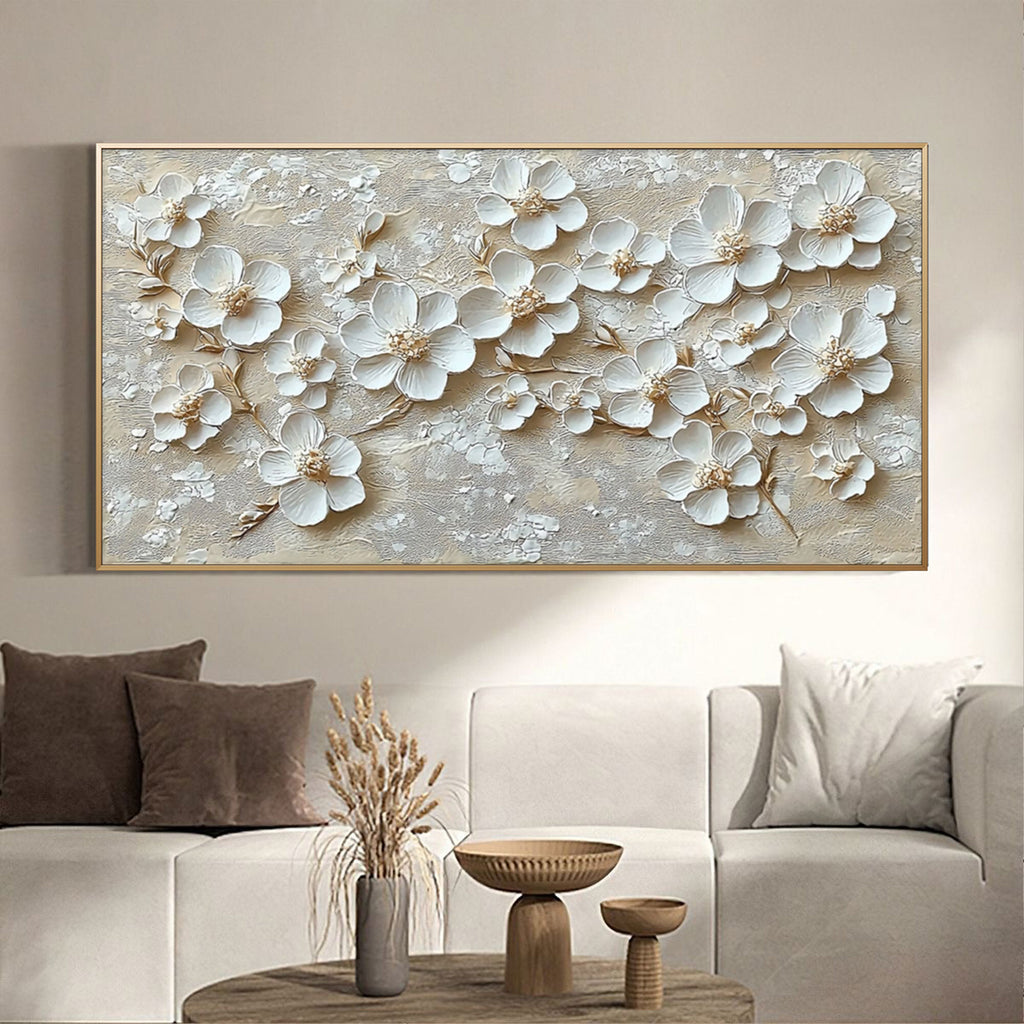 Beige floral canvas art in a stylish living room above a comfortable couch.