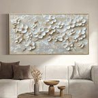 Beige floral canvas art in a stylish living room above a comfortable couch.