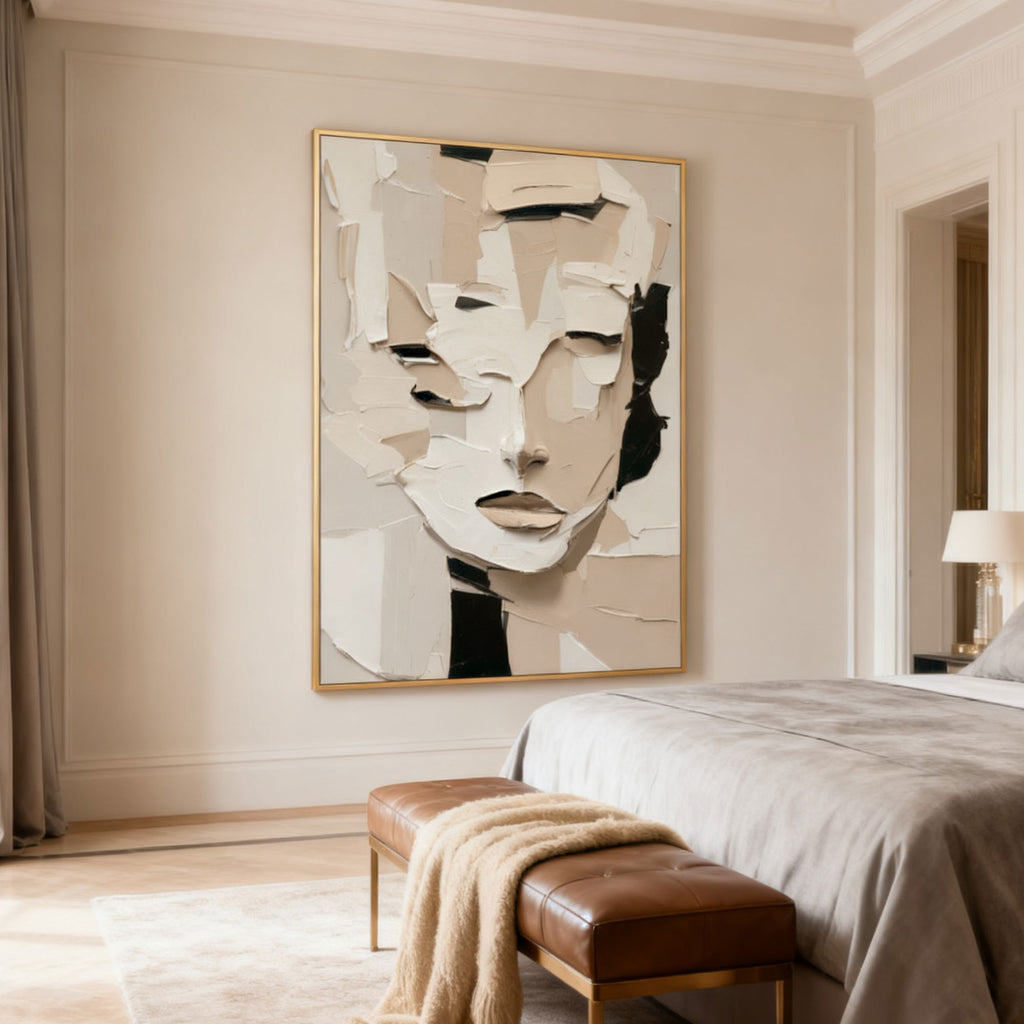 Authentic hand-painted 3D textured abstract portrait canvas art 'Quiet Within' in beige, white, and black with gold frame, displayed in a modern bedroom setting.