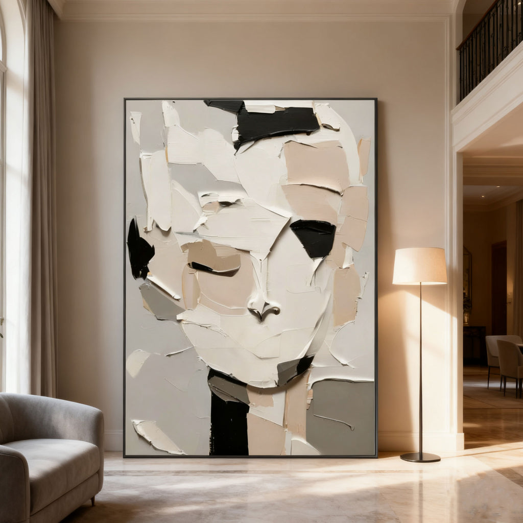 3D textured abstract portrait canvas art 'Silent Self' with thick paint strokes in white, beige, black, and gray, displayed in a modern living room.