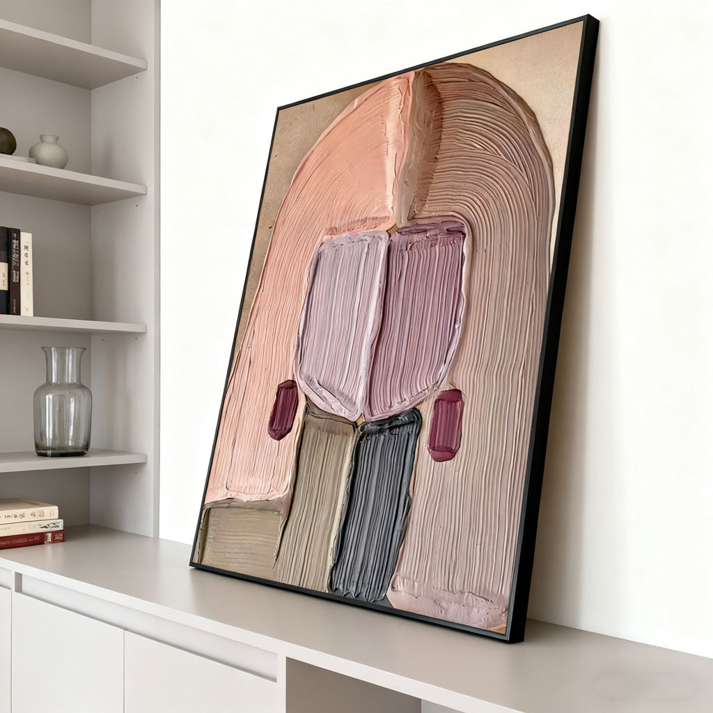 Hand-painted abstract portrait wall art with textured details, soft pastels, black frame, modern interior.