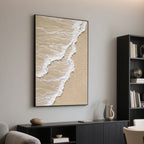 Framed beige and white ocean wave art on wall in living room.