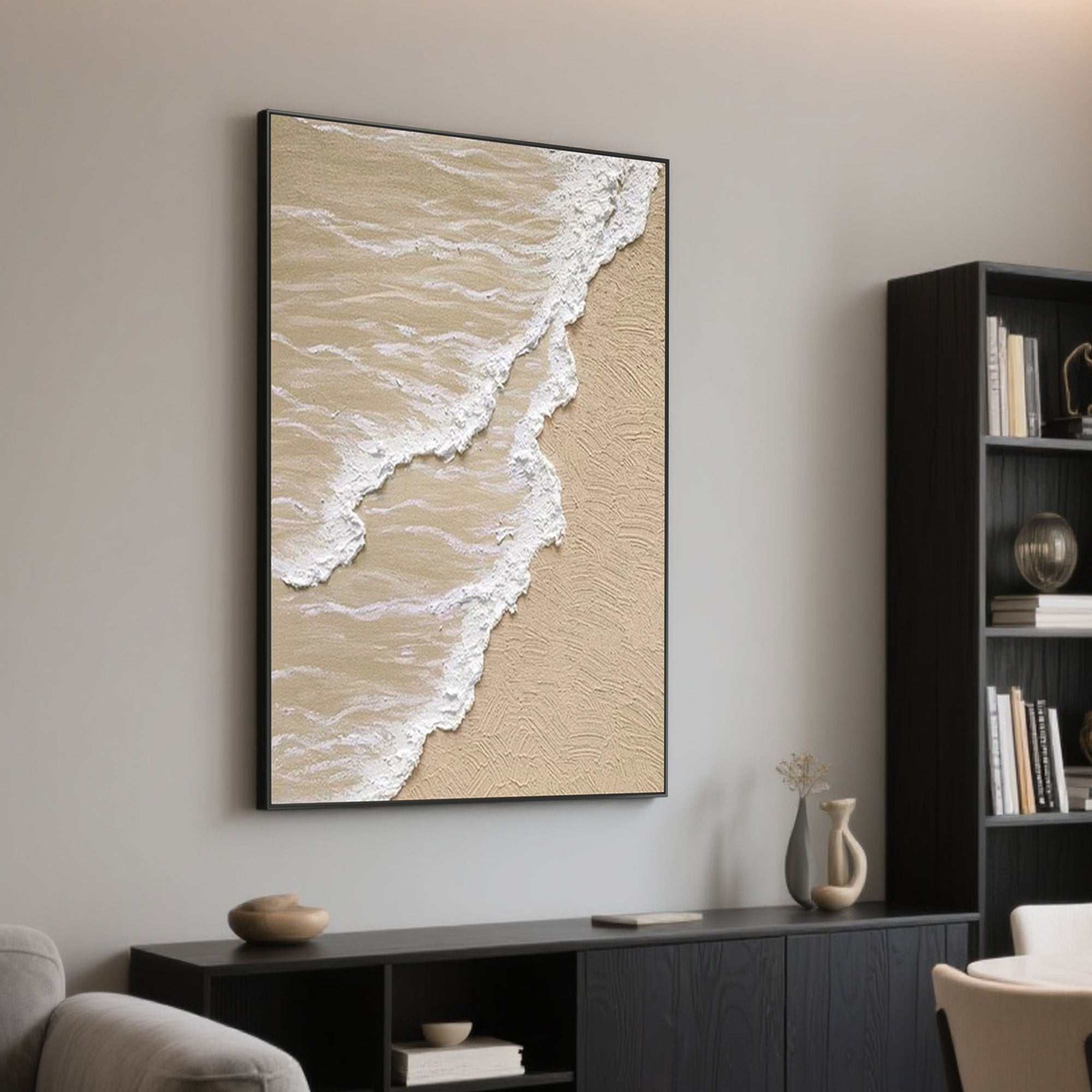 Framed beige and white ocean wave art on wall in living room.