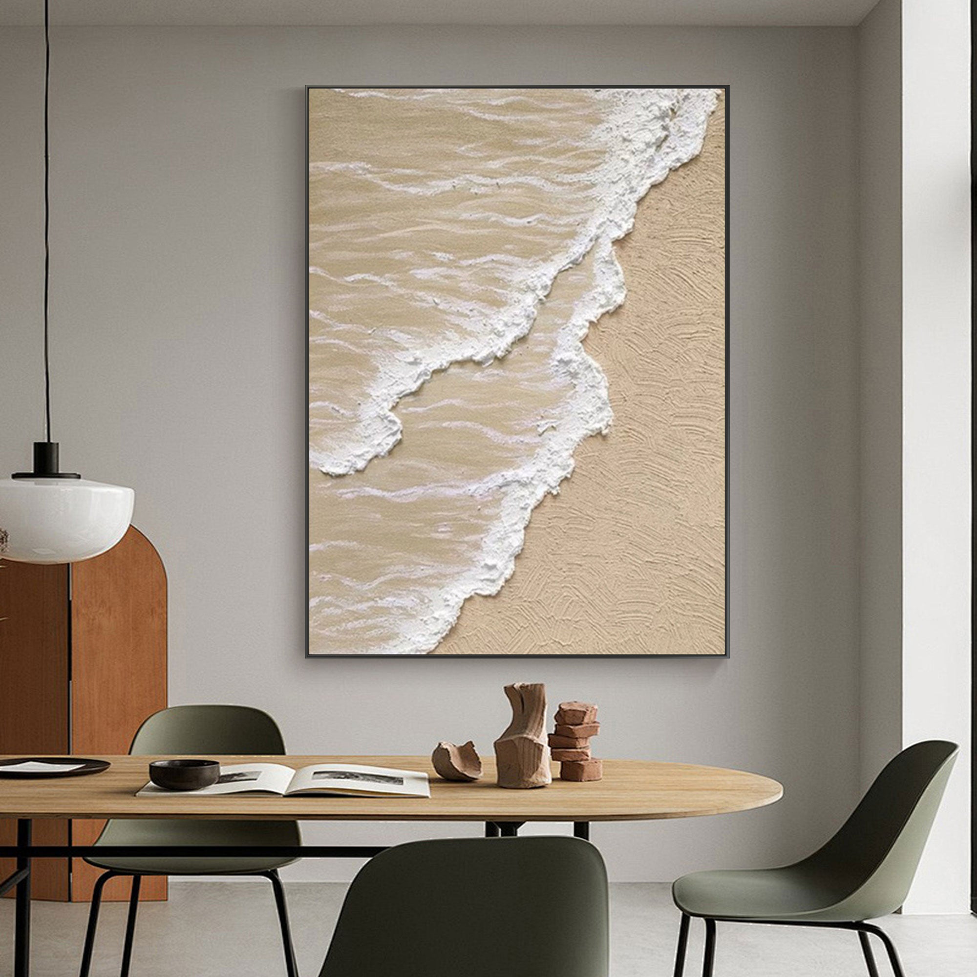 Beige and white 3D ocean wave canvas art in a modern living room.