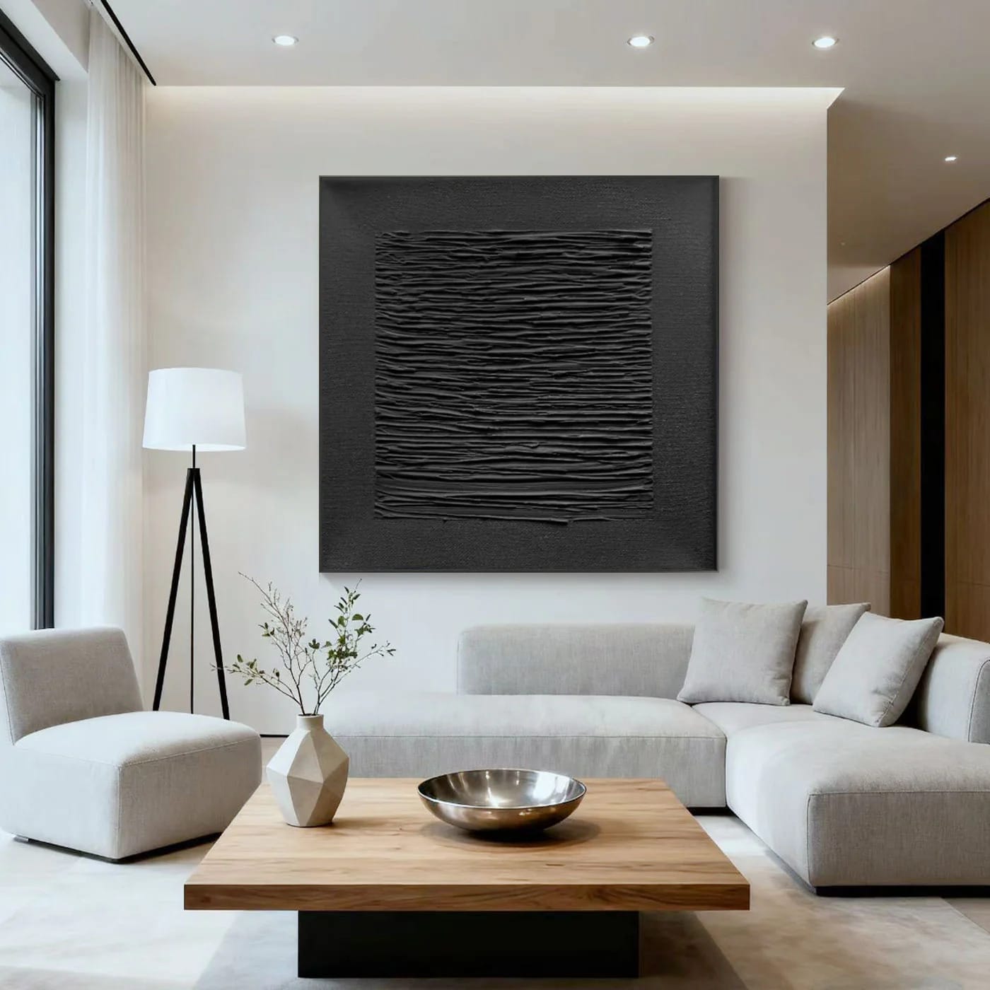 3D textured minimalist black wall art in modern living room with white walls