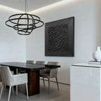 Lumi Gallery's 3D textured minimalist black canvas art with stone skin in modern dining room