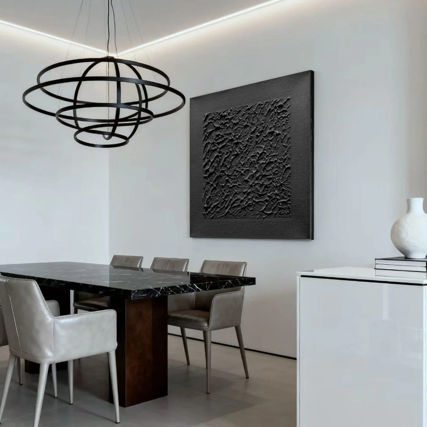 Lumi Gallery's 3D textured minimalist black canvas art with stone skin in modern dining room