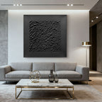 3D textured minimalist black canvas art 'Stone Skin' by Lumi Gallery in modern living room