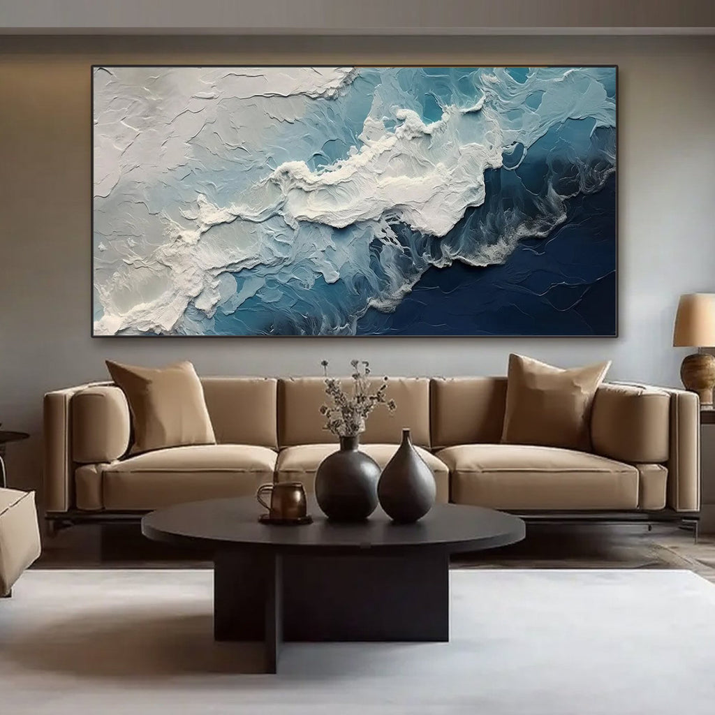 Textured ocean wave canvas art in a living room setting.