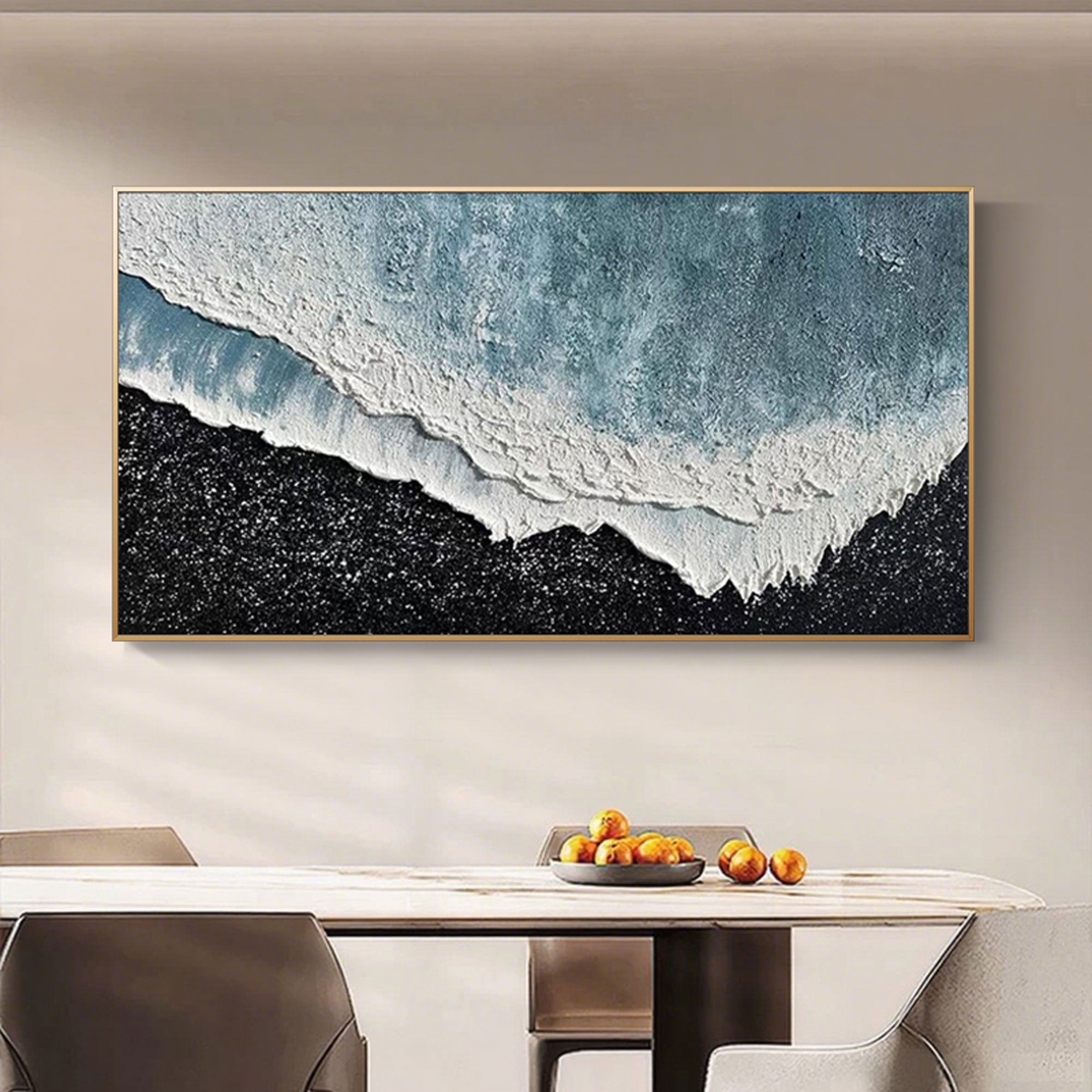 Framed 3D ocean edge canvas art above a dining table.