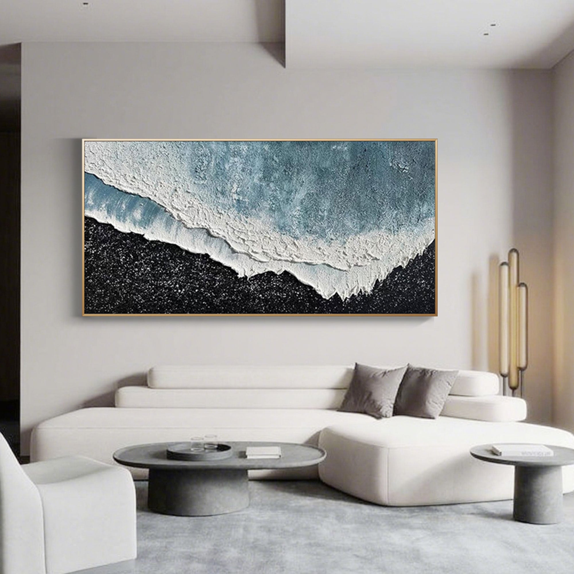 3D ocean canvas art with gold frame in modern living room.