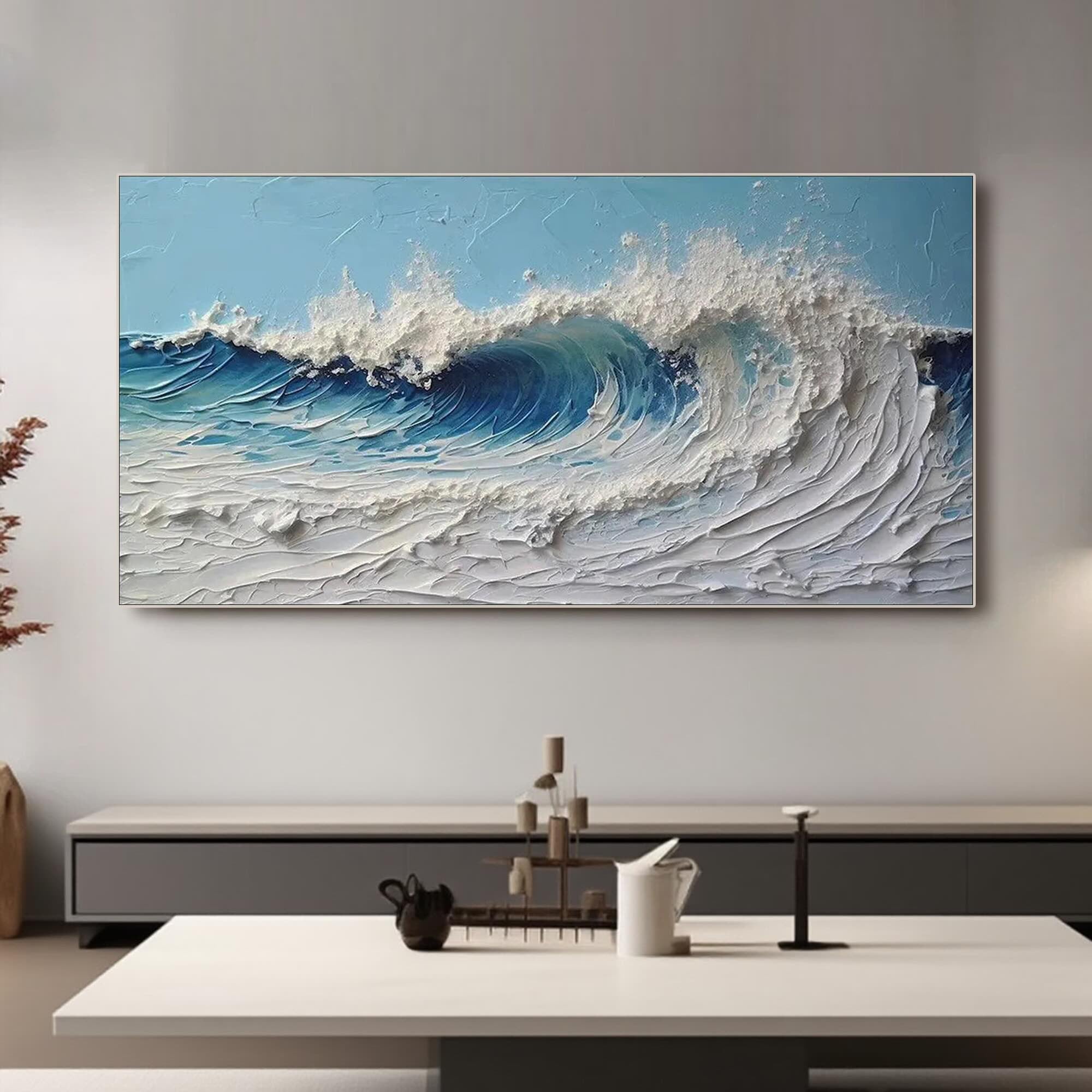 Ocean wave canvas art in a modern living room setting. Silver frame option.