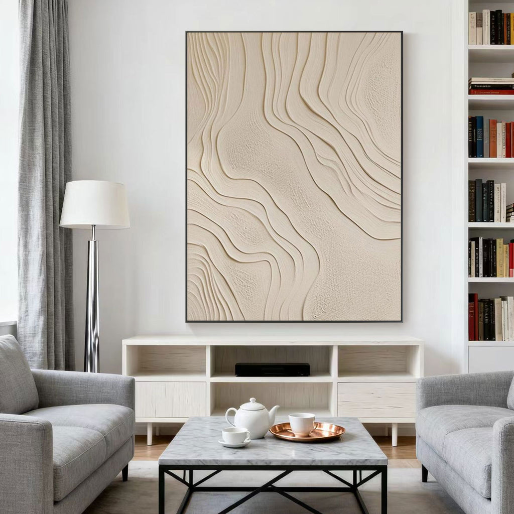 Modern living room with abstract wall art, gray sofa, and coffee table.