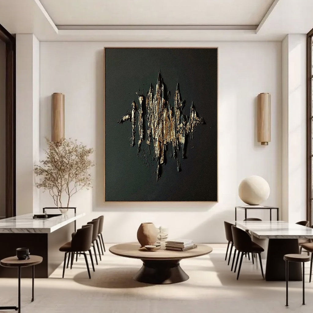 Large gold textured abstract wall art on black canvas in contemporary living room at Lumi Gallery