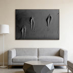 3D textured black minimalist canvas art with torn effect in modern living room