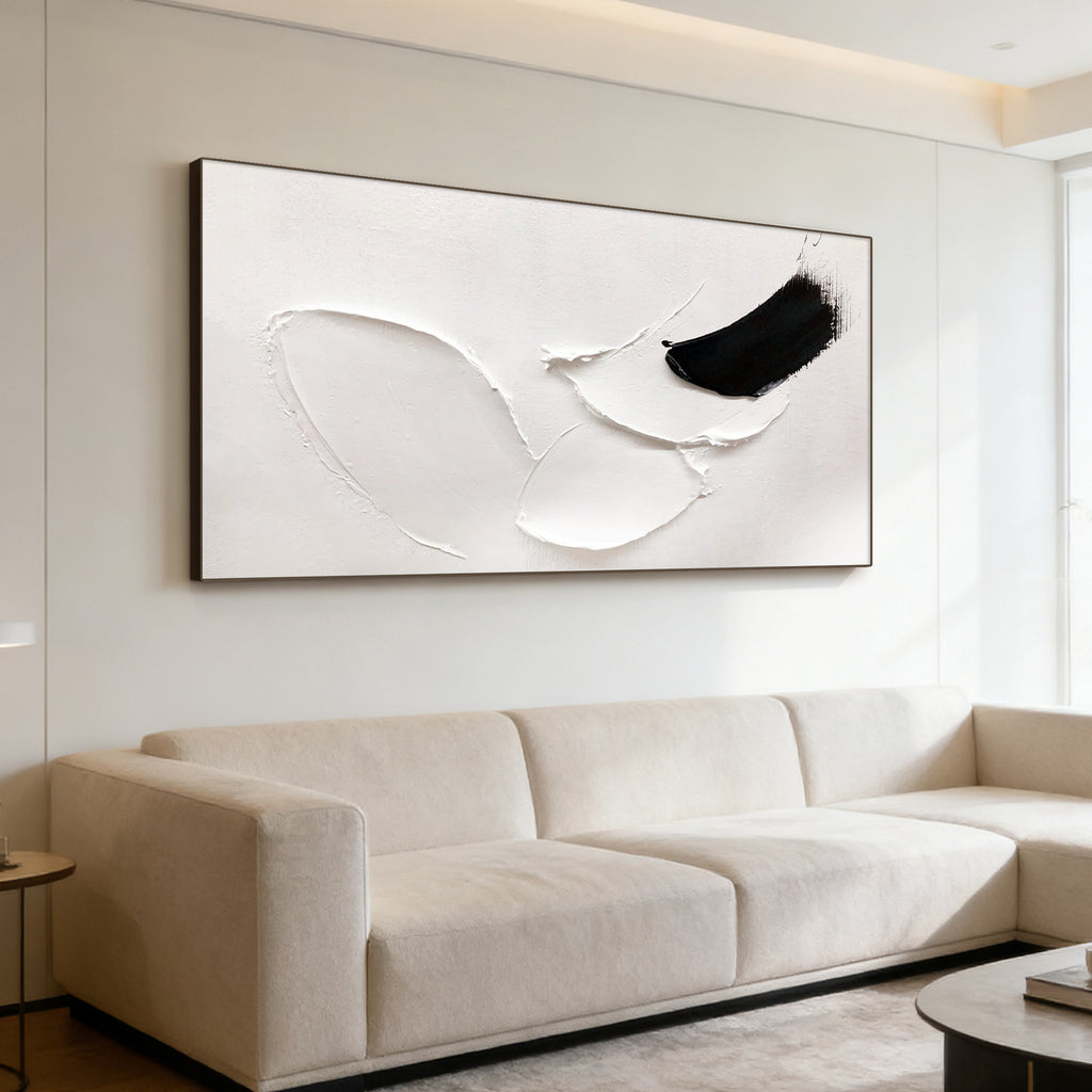 3D Textured Abstract Minimalist White Painting 'Ink Rest' with curved white textured shapes and bold black ink stroke, mounted on wall above light sofa in contemporary living room.