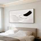 3D textured abstract minimalist white canvas painting 'Ink Rest' with raised white shapes and bold black ink stroke, displayed on bedroom wall above bed.
