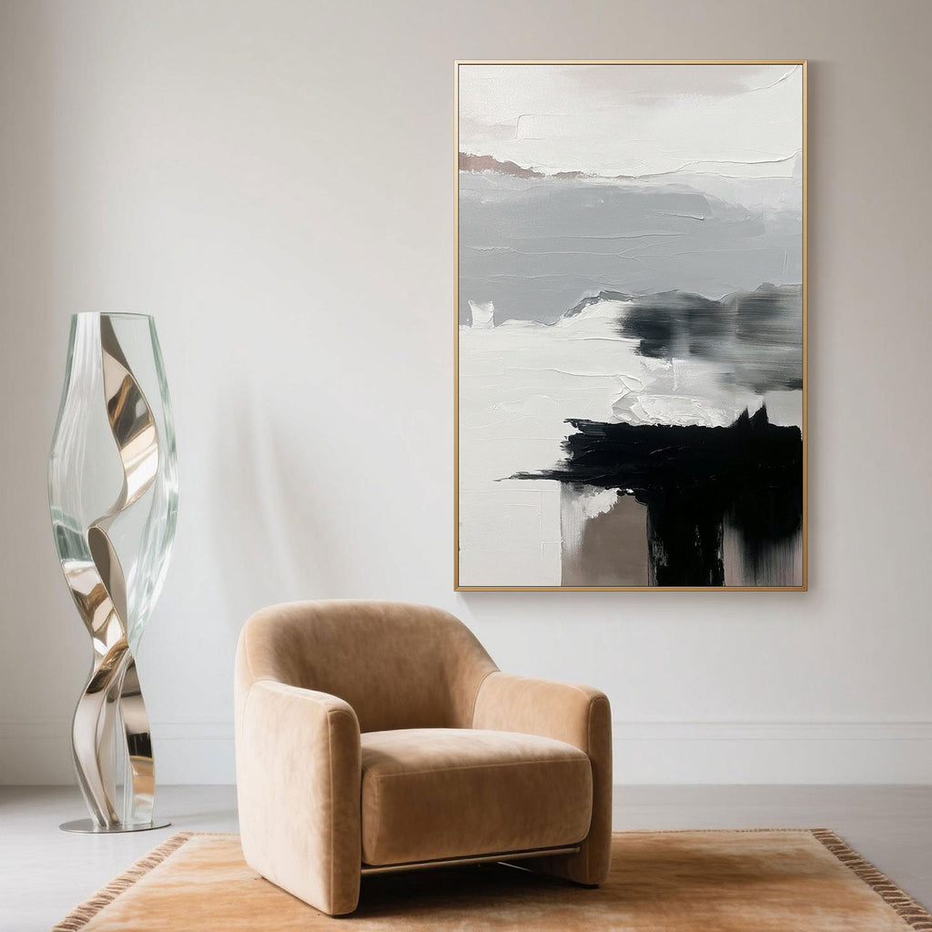 Large Abstract Wall Art in black and white showcased in a minimalist sitting area with curved lighting and a warm-toned rug