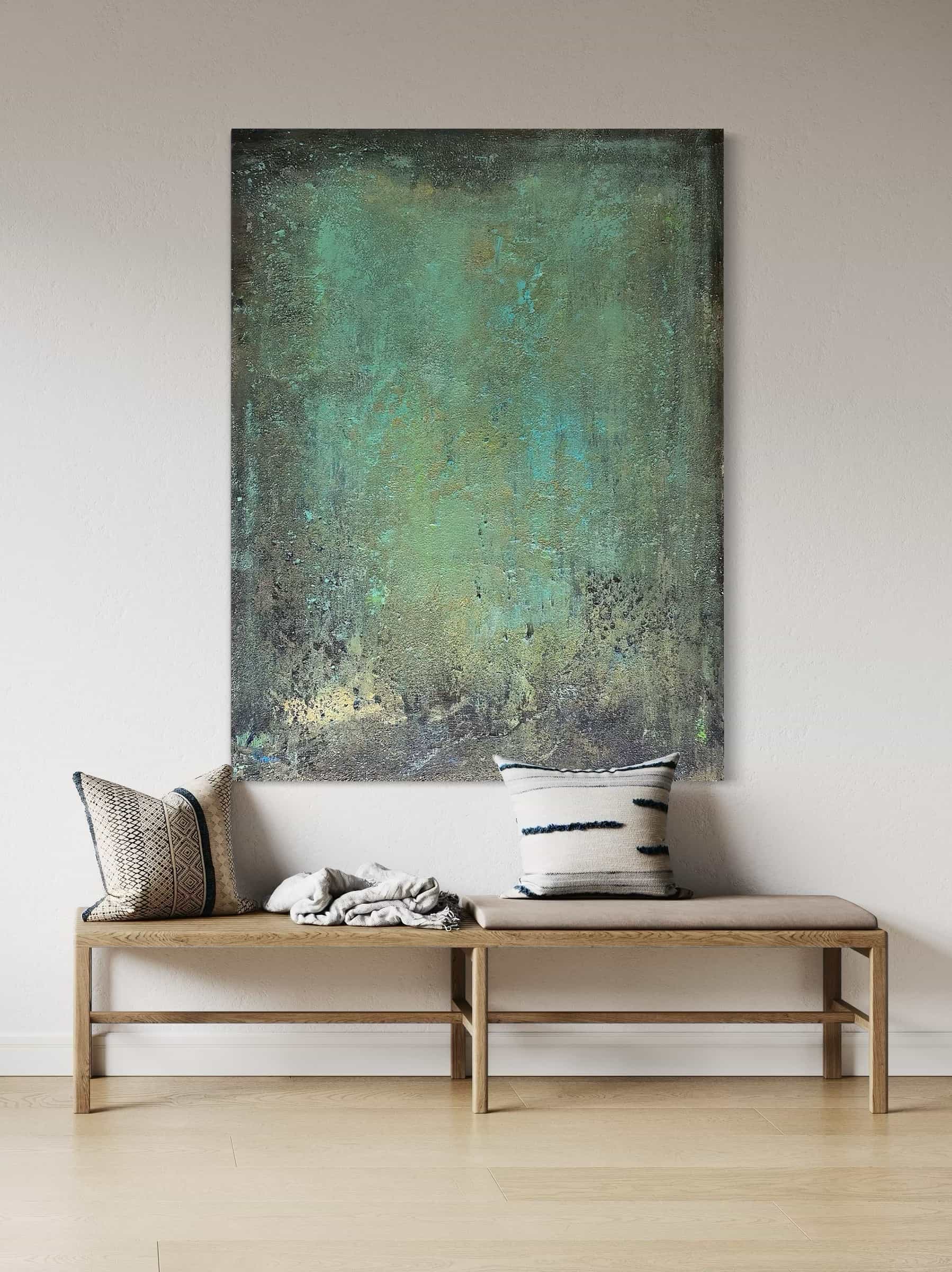 Green and blue textured painting styled vertically in a minimalist space