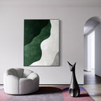 Abstract Coastal canvas art with green waves in minimalist room setting.