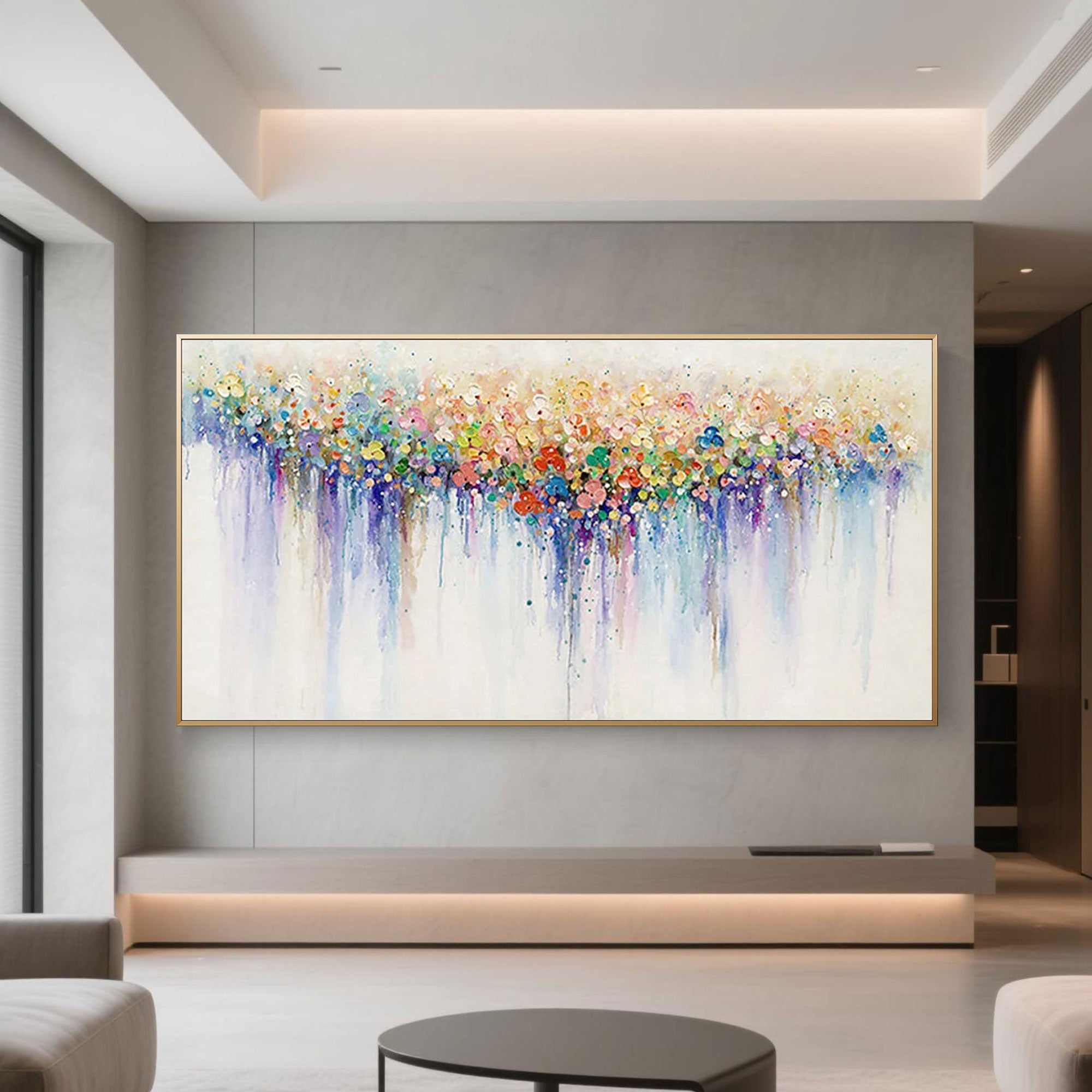Abstract dot art in a gold frame displayed in a modern living room.