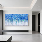 Blue floral wall art above console in contemporary interior.