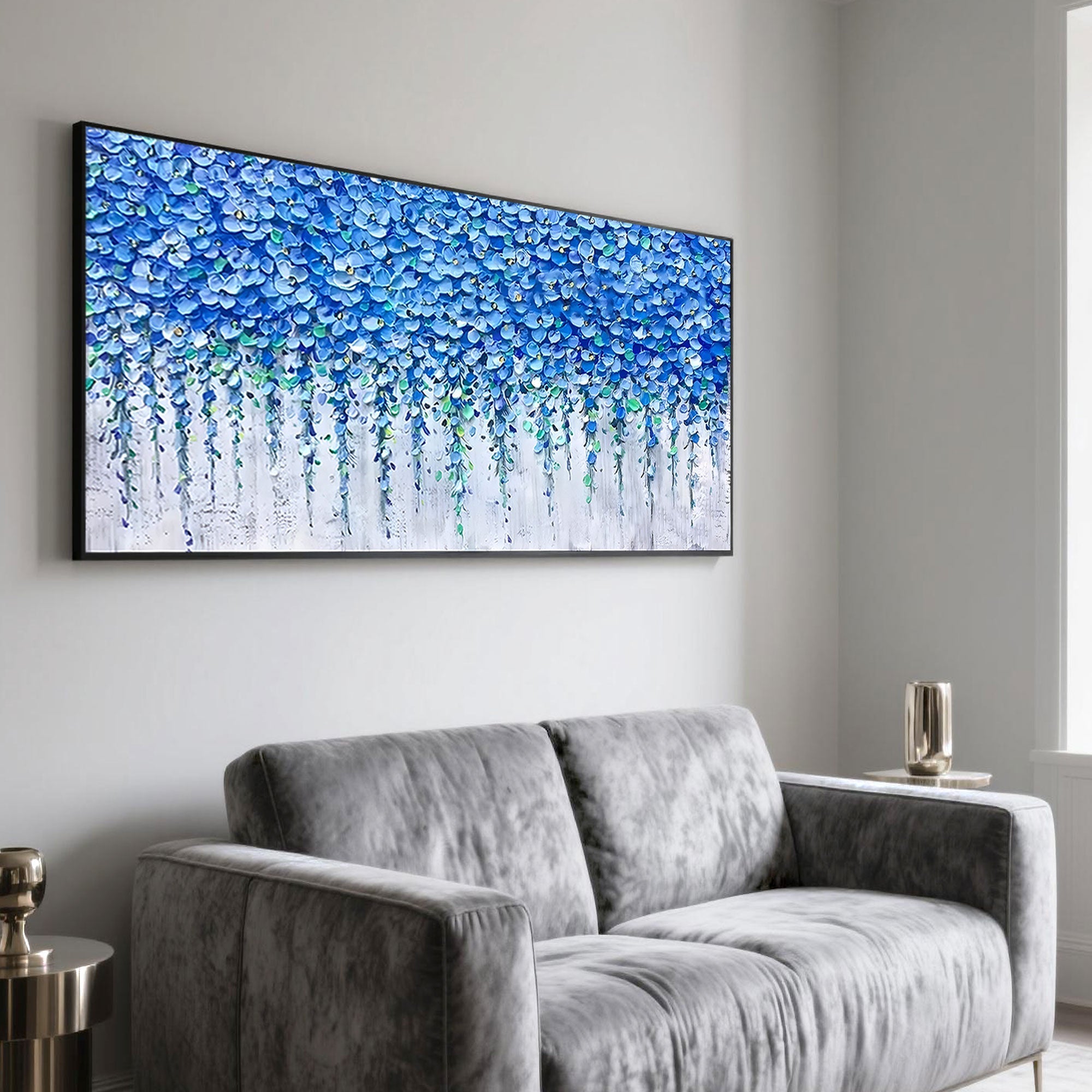 Blue floral art brightening a gray seating area with botanical elegance.