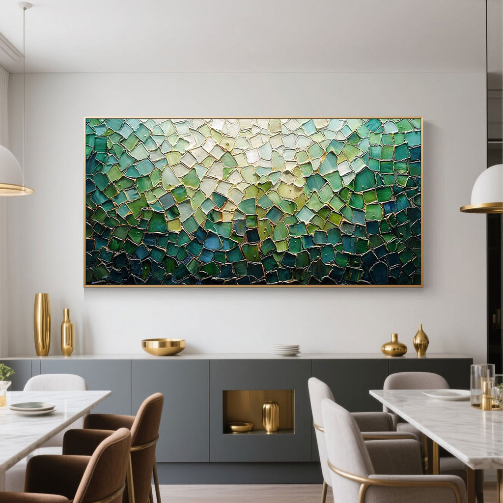 Green mosaic canvas art in a modern dining room setting with gold accents.