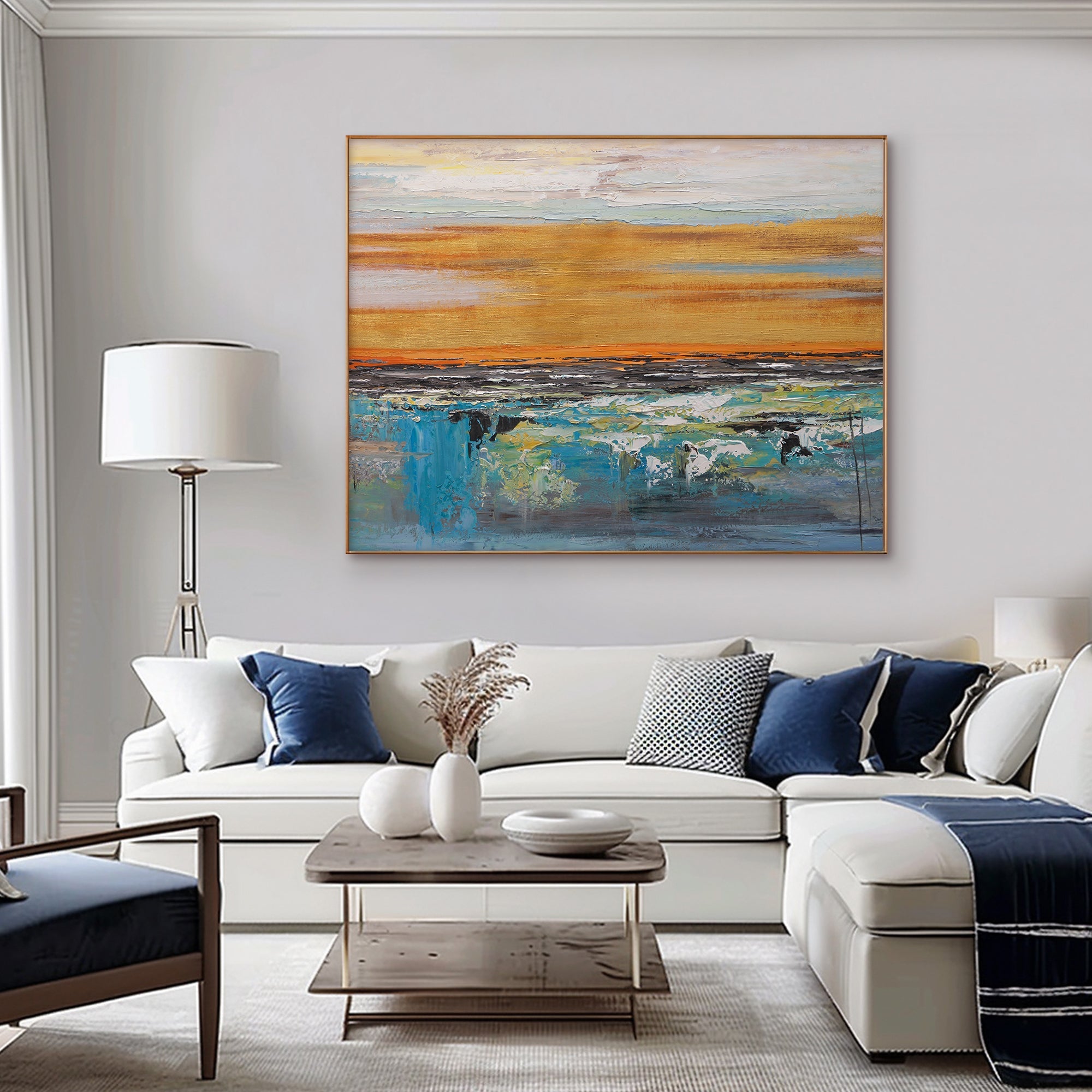 Abstract dusk art above sofa. Modern living room with blue and gold canvas.