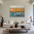 Living room view of abstract 'Dusk' canvas art above a sofa setting.