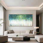 Abstract 'Verdant Veil' painting in a gold frame above a modern living room sofa.