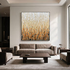 Square canvas art in creamy and caramel colors in a cozy neutral living space.