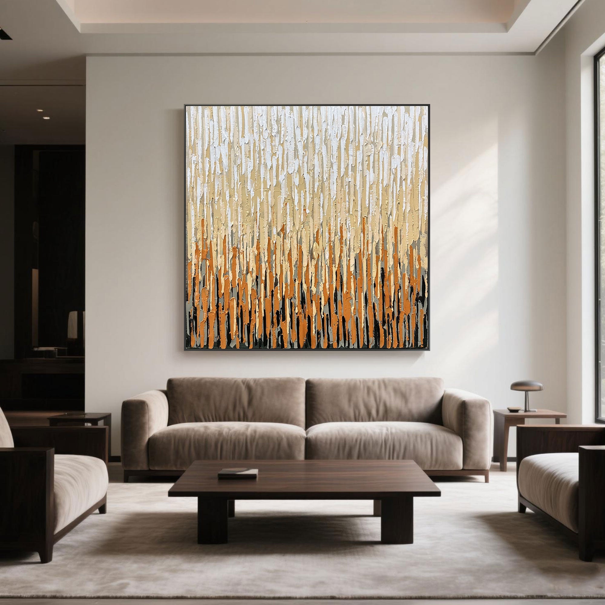 Square canvas art in creamy and caramel colors in a cozy neutral living space.