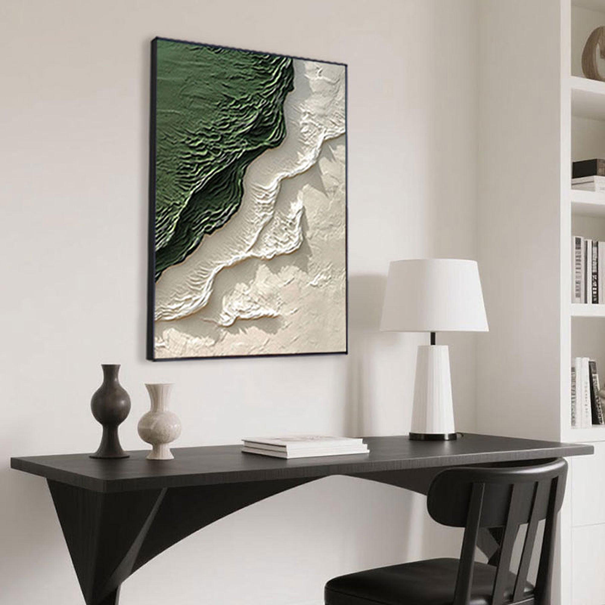 Green and white abstract art above a desk in a modern home office.