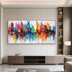 Abstract canvas art above console table in modern living room.
