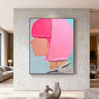 Abstract modern portrait wall art 'Soft Profile' with bright pink and peach tones, textured canvas, mounted in contemporary living room by Lumi Gallery