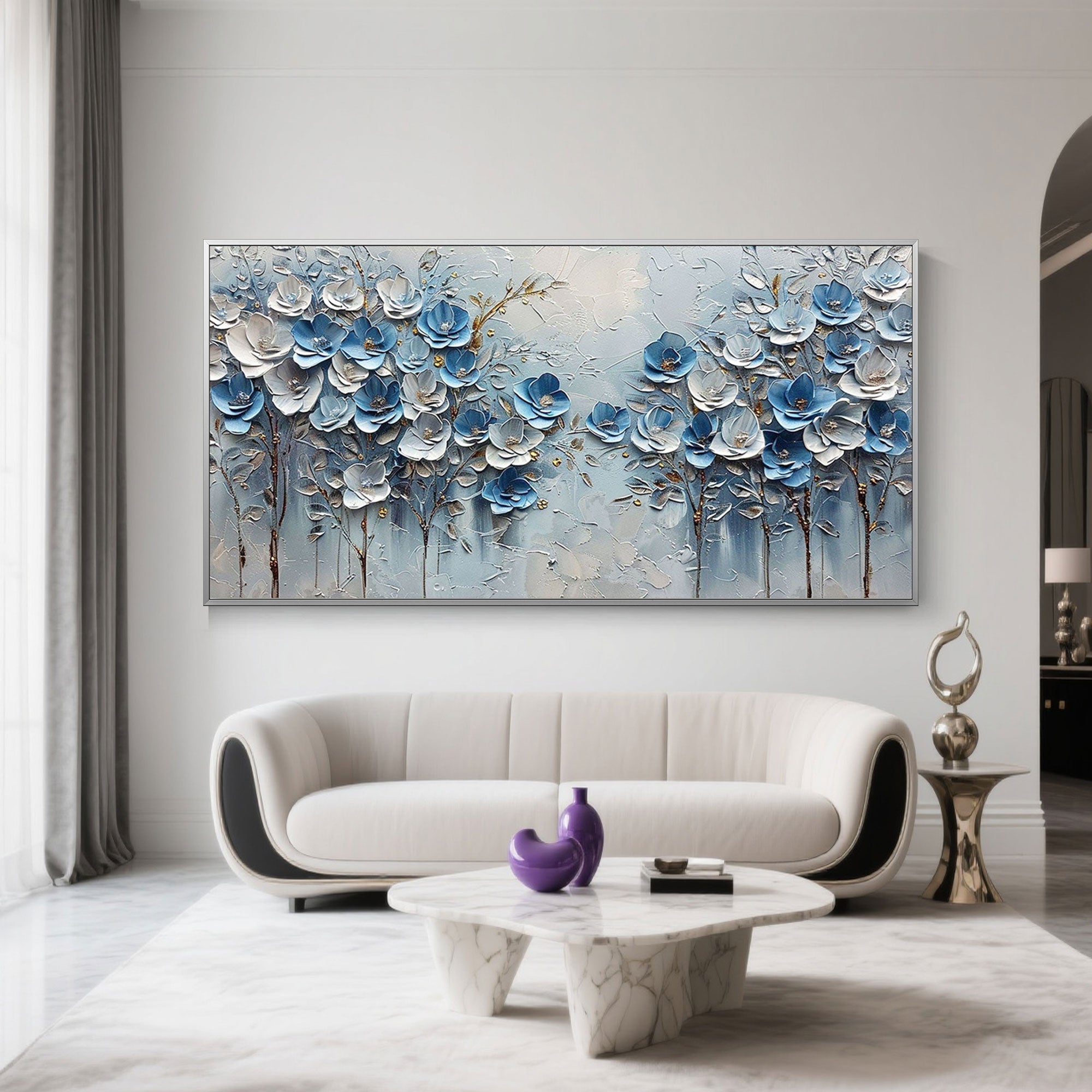 Close-up of blue and white 3D textured flower petals on canvas art.
