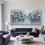 Close-up of blue and white 3D textured flower petals on canvas art.