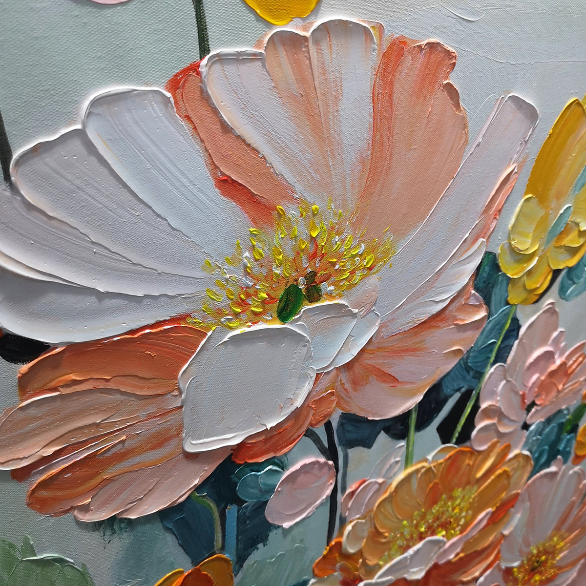 Close-up of textured, hand-painted floral details on canvas art.