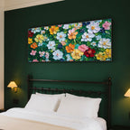 Bloomage floral art displayed above a sofa, enhancing a cozy living room atmosphere.