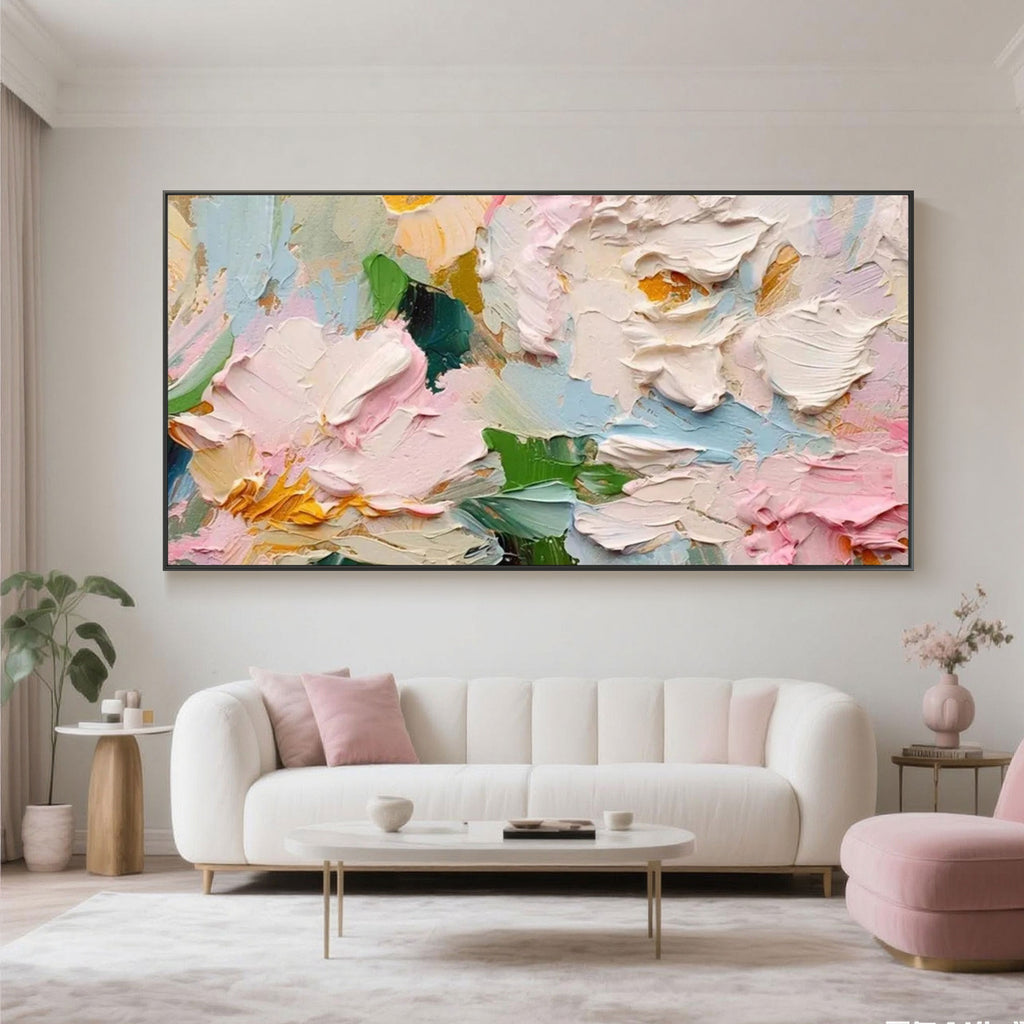 Colorful Blossom Tide floral wall art over a sofa in a bright living room interior.