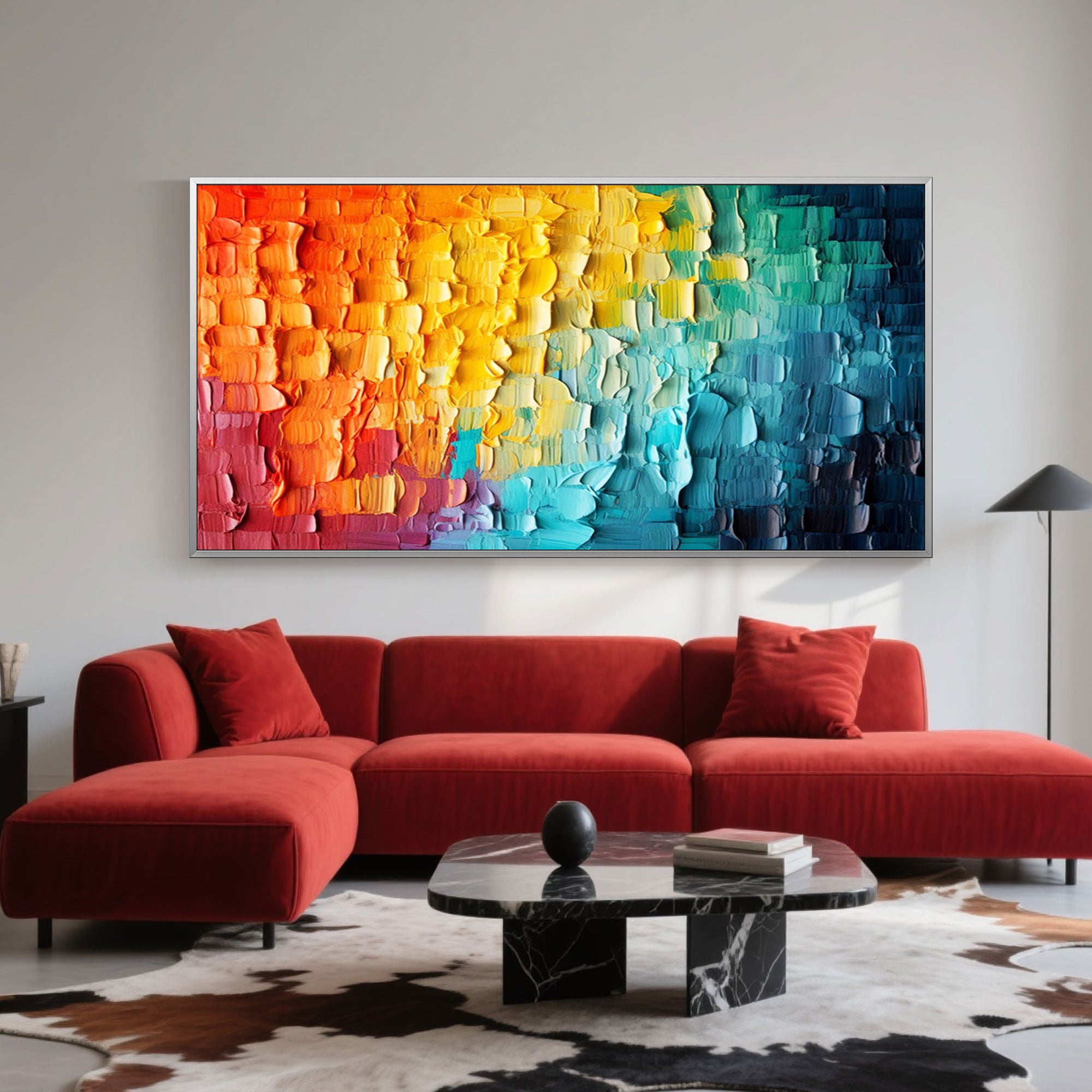 Abstract 3D art, Chromatic Flow, in a silver frame above a red sectional sofa.
