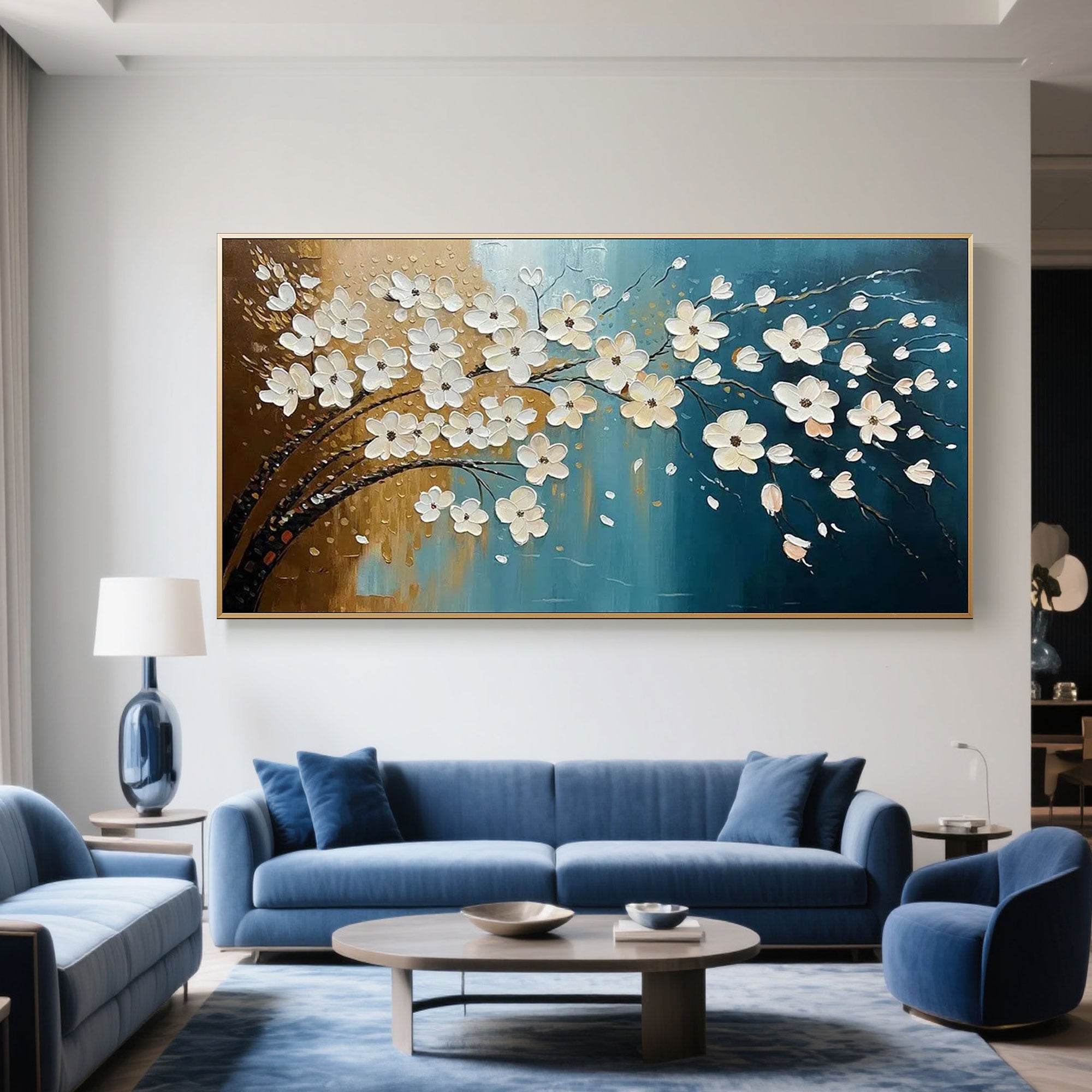 Abstract floral canvas art displayed above a blue sofa in a living room setting.