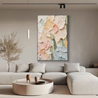 Floral textured canvas art in a living room setting with a gold frame.